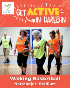 Group of active adults playing a game of indoor walking basketball
